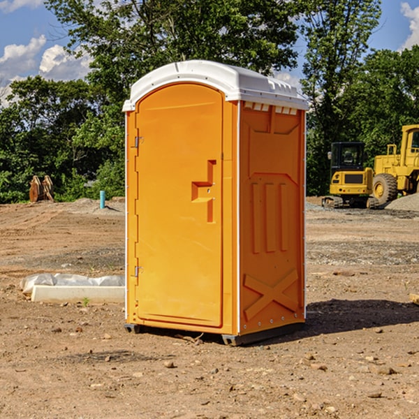 what is the cost difference between standard and deluxe portable restroom rentals in Brave